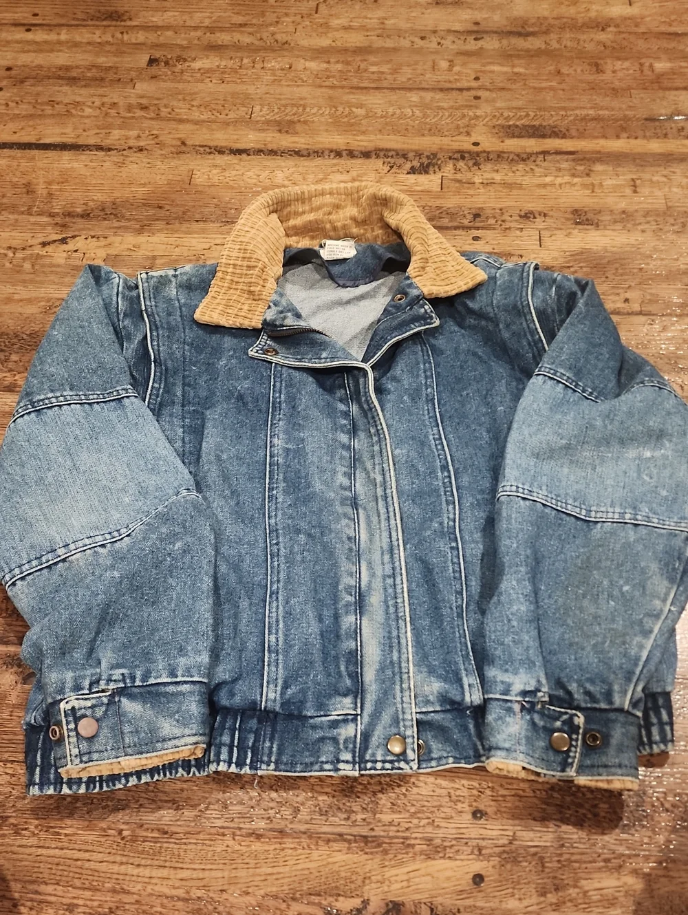 Vtg blue denim bomber jacket featuring a distinctive brown color